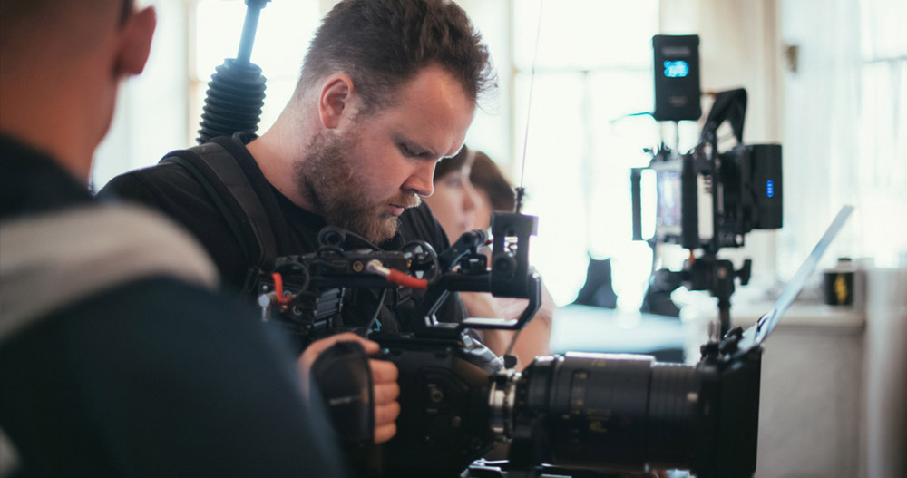 Director Of Photography With A Camera In His Hands