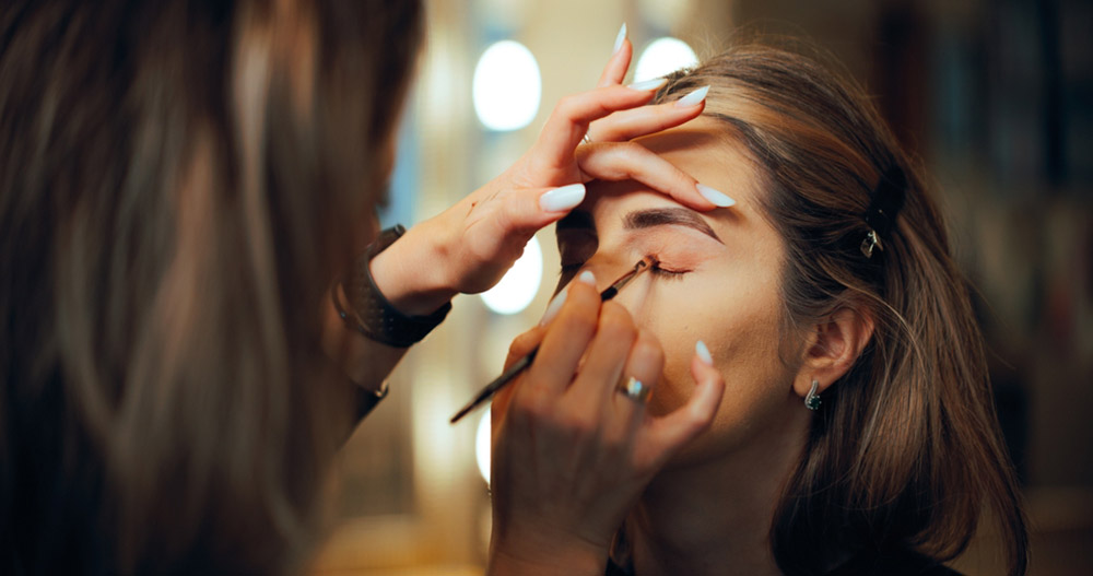 Professional Make-up Artist Applying Eye-shadow With A Brush