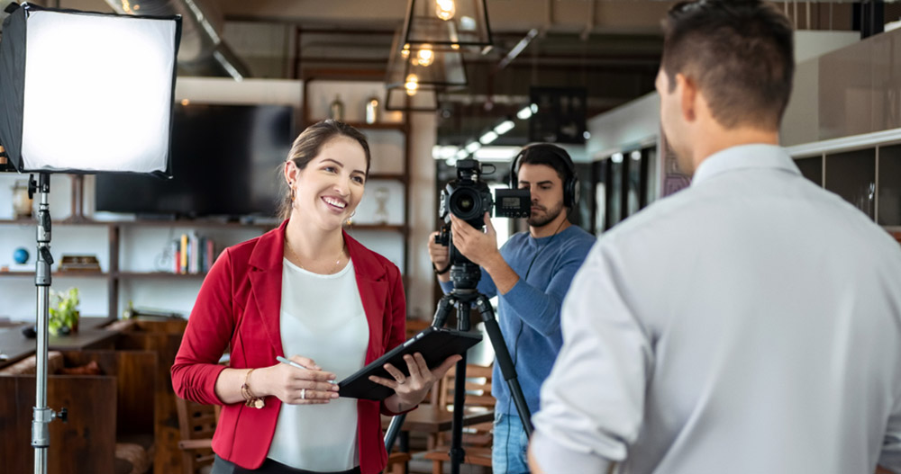 Happy Businessman During Corporate Interview With Female Journalist. Manager Answering