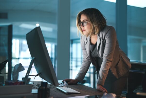 Employee Reading Computer In Office