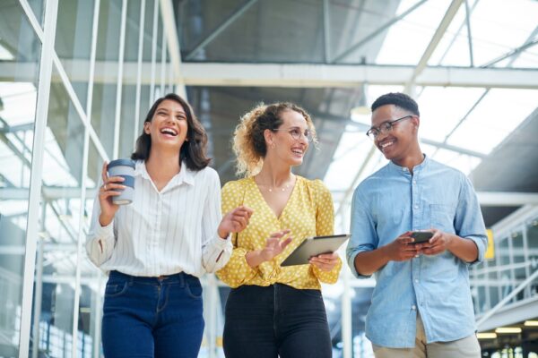 Conversation And Business People In Office Laughing